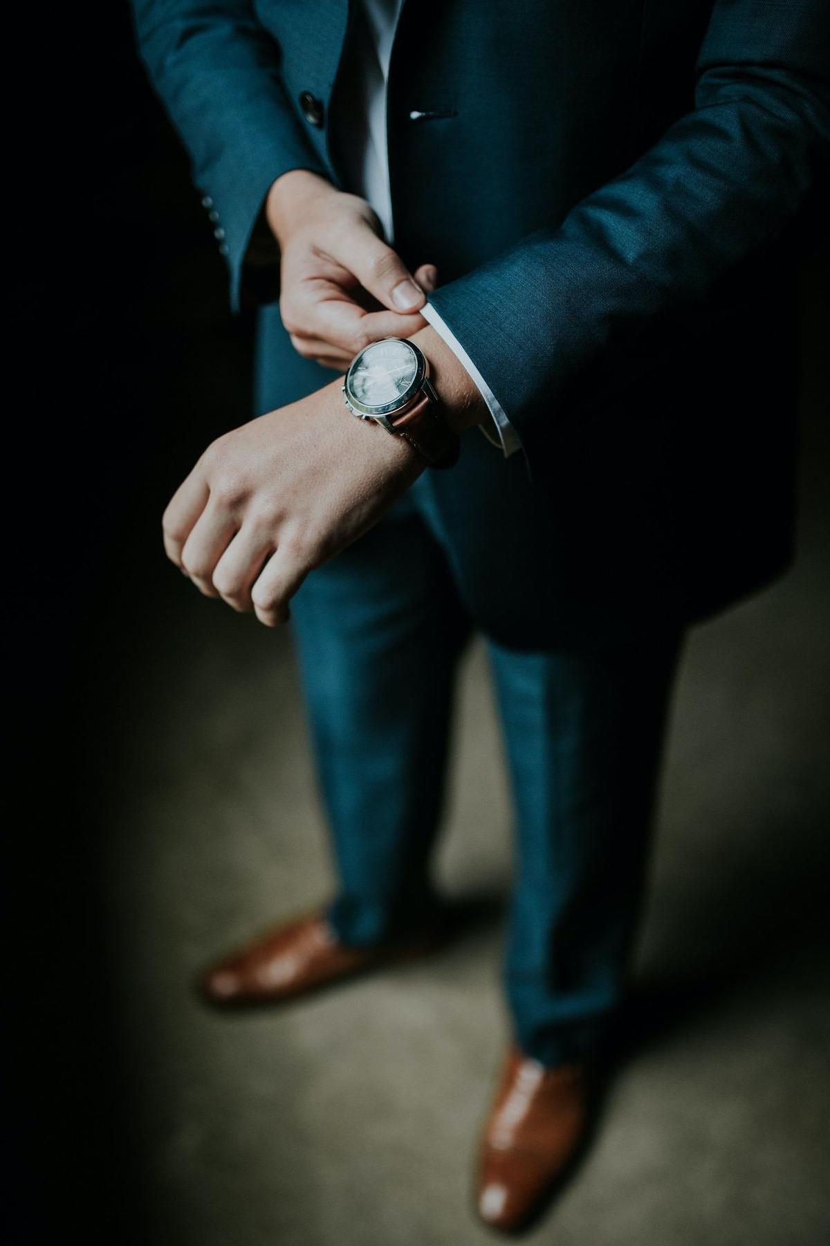 man holding his black suit